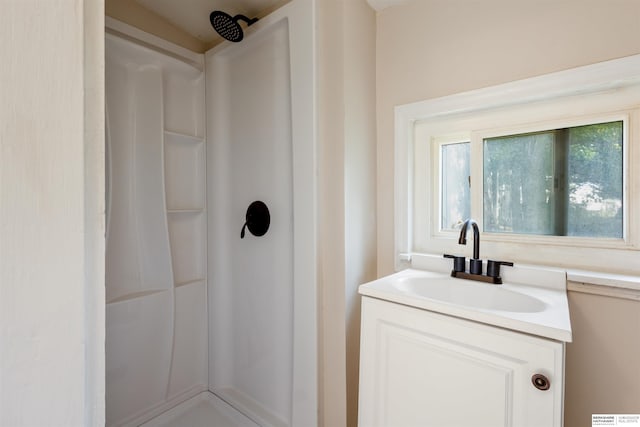 1444 S 16th St, Omaha, NE 68108 - bathroom featuring a shower and vanity