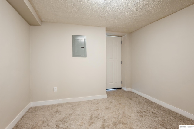 1444 S 16th St, Omaha, NE 68108 - carpeted spare room featuring electric panel, a textured ceiling, and baseboards