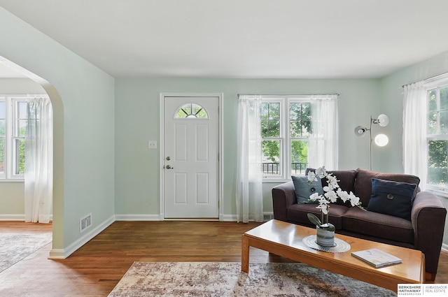 1511 S 60th St, Omaha, NE 68106 - living room with wood finished floors, arched walkways, and baseboards
