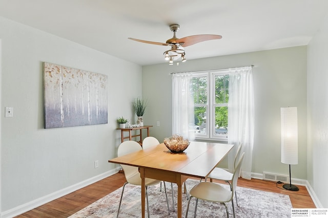 1511 S 60th St, Omaha, NE 68106 - dining area with wood finished floors, ceiling fan, and baseboards