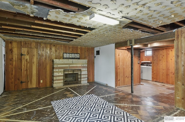 1511 S 60th St, Omaha, NE 68106 - unfurnished living room with washer / dryer, wood walls, and a fireplace