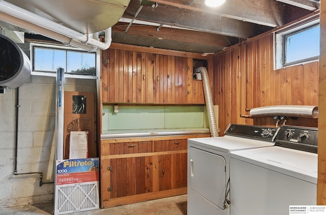 1511 S 60th St, Omaha, NE 68106 - laundry area with independent washer and dryer, concrete block wall, and wooden walls