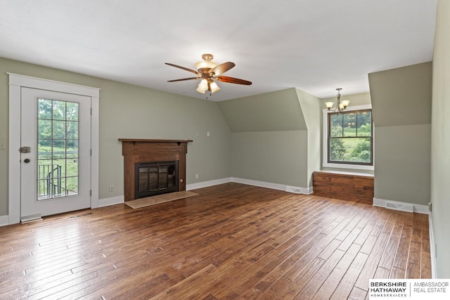 17409 Webster Blvd, Plattsmouth, NE 68048 - unfurnished living room with healthy amount of natural light, hardwood / wood-style floors, a chandelier, a fireplace with flush hearth, and vaulted ceiling