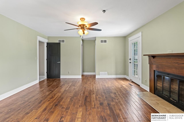 17409 Webster Blvd, Plattsmouth, NE 68048 - unfurnished living room with a fireplace with flush hearth, a ceiling fan, hardwood / wood-style flooring, and baseboards