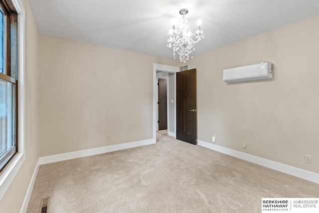 17409 Webster Blvd, Plattsmouth, NE 68048 - carpeted empty room featuring a wall mounted air conditioner, a chandelier, and baseboards