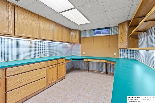 17409 Webster Blvd, Plattsmouth, NE 68048 - kitchen with light tile patterned floors, a paneled ceiling, open shelves, and backsplash