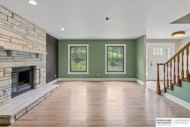 17409 Webster Blvd, Plattsmouth, NE 68048 - unfurnished living room with plenty of natural light, baseboards, hardwood / wood-style flooring, and recessed lighting