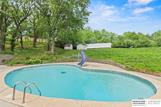 17409 Webster Blvd, Plattsmouth, NE 68048 - view of pool featuring a water slide, a lawn, and view of wooded area