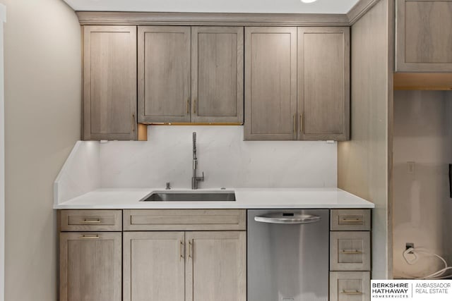 17409 Webster Blvd, Plattsmouth, NE 68048 - kitchen featuring stainless steel dishwasher, a sink, and light countertops