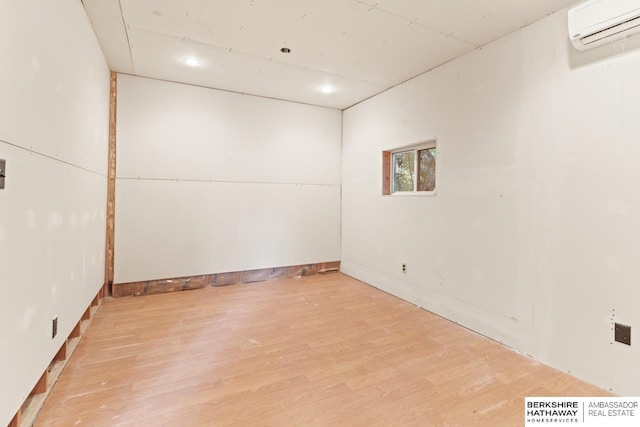 17409 Webster Blvd, Plattsmouth, NE 68048 - unfurnished room with a wall mounted air conditioner and wood finished floors