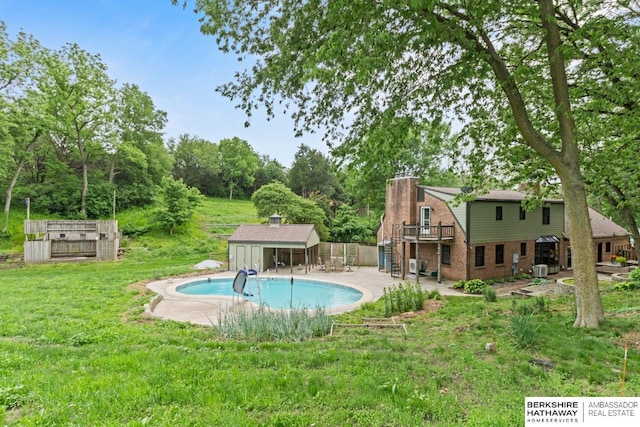 17409 Webster Blvd, Plattsmouth, NE 68048 - outdoor pool with view of wooded area, a patio, and a wooden deck