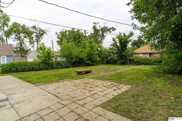 4328 Burdette St, Omaha, NE 68111 - view of green lawn with a patio