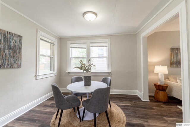 4328 Burdette St, Omaha, NE 68111 - dining area with dark wood-style flooring, baseboards, and crown molding
