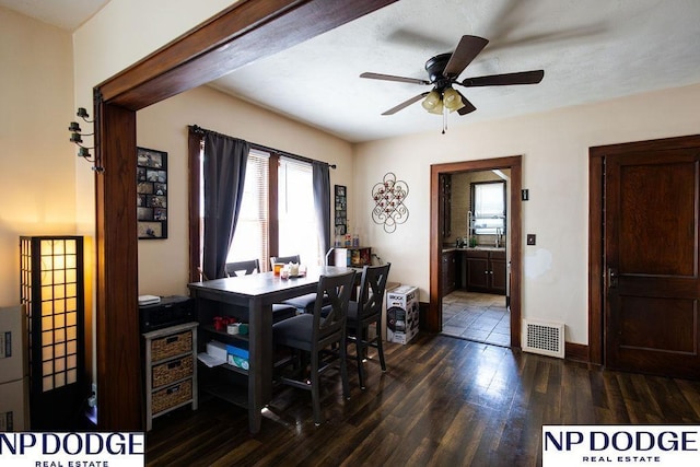 4023 Maple St, Omaha, NE 68111 - office featuring plenty of natural light, dark wood-type flooring, ceiling fan, and baseboards