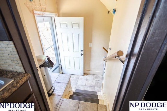 4023 Maple St, Omaha, NE 68111 - entrance foyer with baseboards and light tile patterned floors