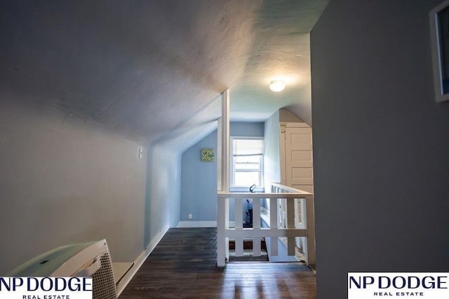 4023 Maple St, Omaha, NE 68111 - additional living space featuring vaulted ceiling, wood finished floors, and baseboards
