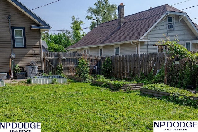 4023 Maple St, Omaha, NE 68111 - view of yard featuring a vegetable garden and cooling unit