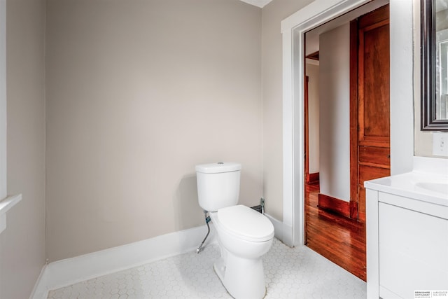 620 Dorcas St, Omaha, NE 68108 - half bath with toilet, vanity, baseboards, and tile patterned floors