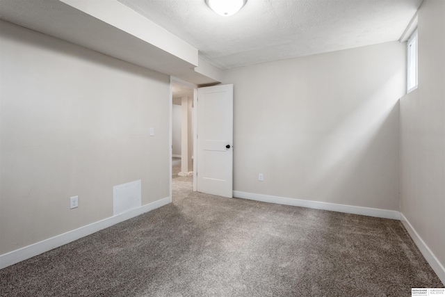 620 Dorcas St, Omaha, NE 68108 - carpeted empty room with baseboards and a textured ceiling