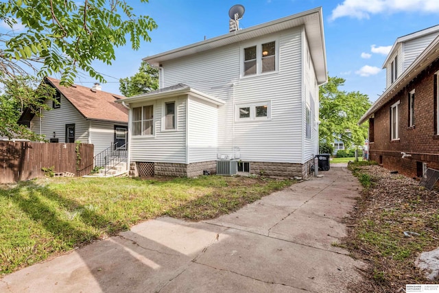 620 Dorcas St, Omaha, NE 68108 - back of property featuring entry steps and central AC unit