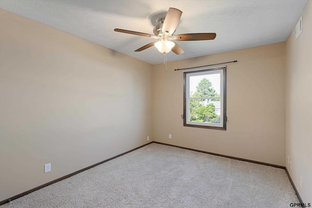 12749 Woodcrest Plz Unit 211B, Omaha, NE 68137 - spare room with a ceiling fan, light carpet, baseboards, and a textured ceiling