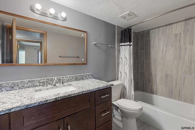 12749 Woodcrest Plz Unit 211B, Omaha, NE 68137 - full bathroom featuring vanity, a textured ceiling, toilet, and shower / bathtub combination with curtain
