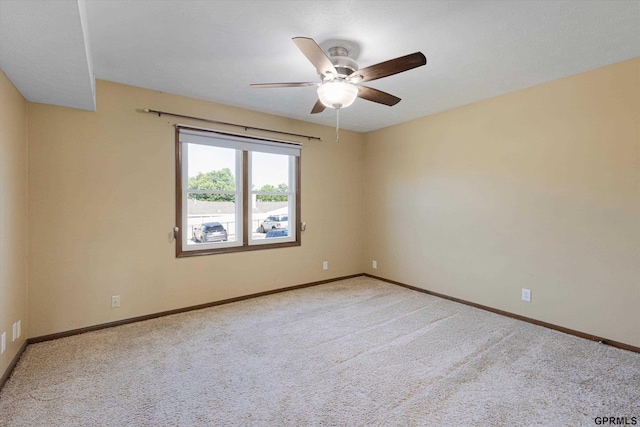 12749 Woodcrest Plz Unit 211B, Omaha, NE 68137 - spare room featuring a ceiling fan, carpet, and baseboards