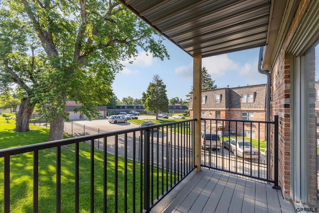 12749 Woodcrest Plz Unit 211B, Omaha, NE 68137 - deck featuring a lawn