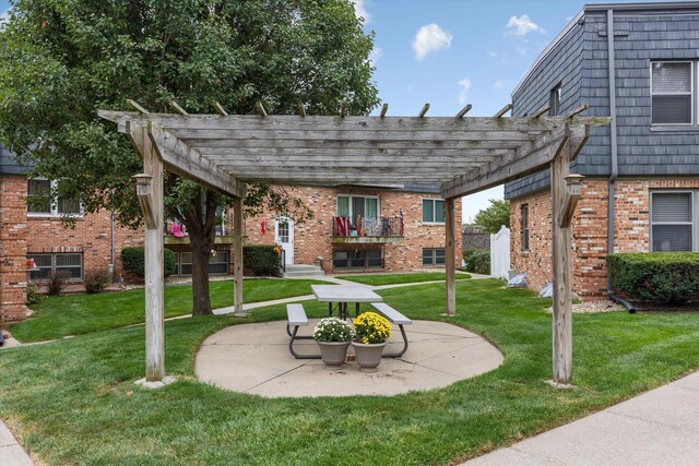 12749 Woodcrest Plz Unit 211B, Omaha, NE 68137 - view of home's community featuring a pergola, a lawn, and a patio area