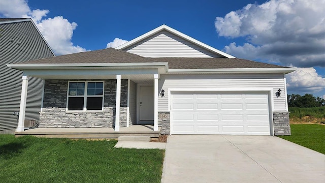 8512 S 179th St, Omaha, NE 68137 - ranch-style house featuring stone siding, an attached garage, driveway, a porch, and a front lawn