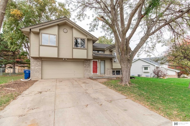 7824 La Vista Dr, La Vista, NE 68128 - view of front of house with brick siding, a garage, and concrete driveway