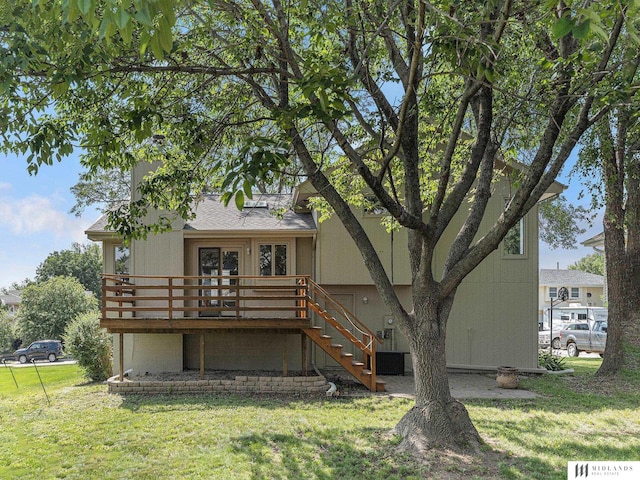 7824 La Vista Dr, La Vista, NE 68128 - rear view of house with a yard, a deck, and stairway