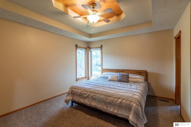 7824 La Vista Dr, La Vista, NE 68128 - bedroom featuring carpet flooring, a raised ceiling, and ceiling fan