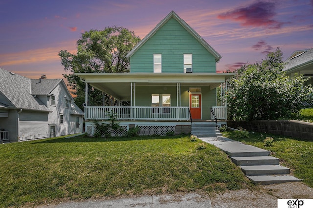 4701 Davenport St, Omaha, NE 68132 - view of front facade featuring a porch and a yard