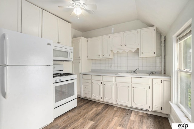4701 Davenport St, Omaha, NE 68132 - kitchen featuring white appliances, white cabinets, tasteful backsplash, wood finished floors, and vaulted ceiling
