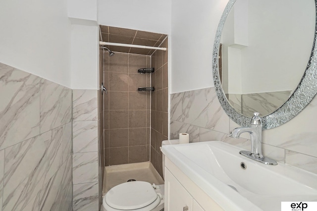 4701 Davenport St, Omaha, NE 68132 - full bathroom with tile walls, a shower stall, vanity, and wainscoting
