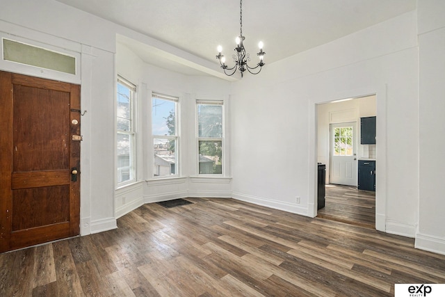 4701 Davenport St, Omaha, NE 68132 - foyer entrance featuring a chandelier and dark wood-style floors