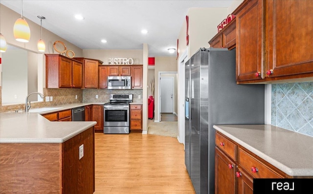 19887 I St, Omaha, NE 68135 - kitchen with appliances with stainless steel finishes, light wood-style floors, a sink, backsplash, and recessed lighting