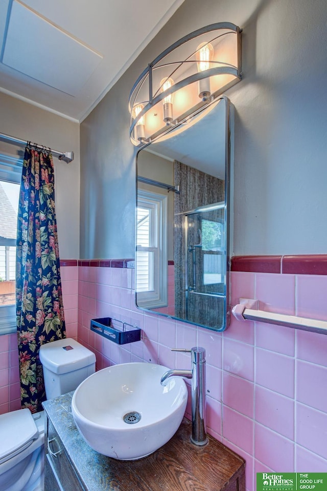 902 S 57th St, Omaha, NE 68106 - full bath with tile walls, curtained shower, a wainscoted wall, and vanity