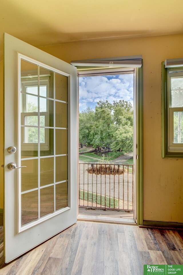 902 S 57th St, Omaha, NE 68106 - doorway to outside with wood finished floors
