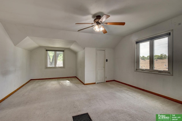 902 S 57th St, Omaha, NE 68106 - additional living space with lofted ceiling, light colored carpet, and ceiling fan