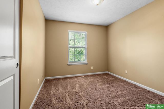 14463 Reynolds St, Omaha, NE 68007 - carpeted empty room with baseboards