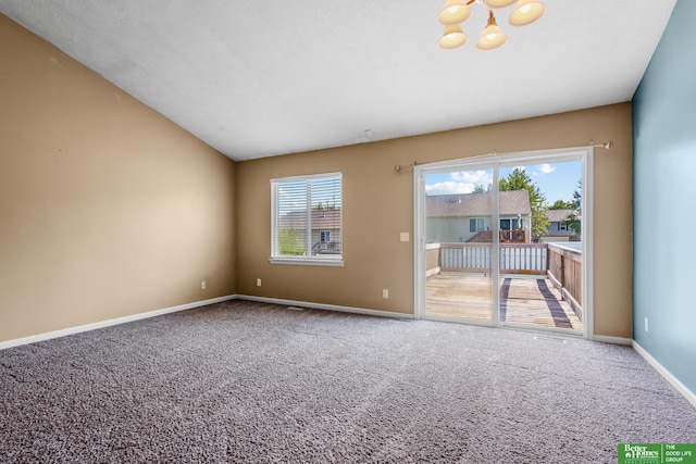 14463 Reynolds St, Omaha, NE 68007 - carpeted spare room with a chandelier and baseboards