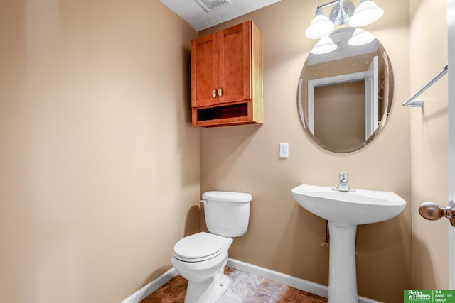 14463 Reynolds St, Omaha, NE 68007 - bathroom featuring toilet and baseboards