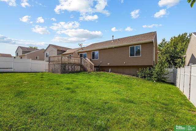 14463 Reynolds St, Omaha, NE 68007 - back of property with a fenced backyard, a wooden deck, and stairway