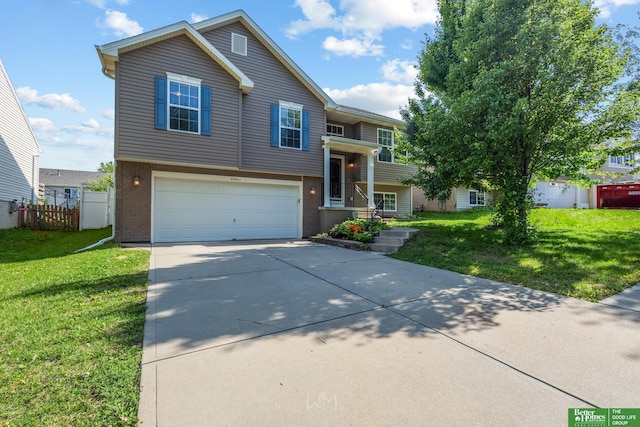 14463 Reynolds St, Omaha, NE 68007 - raised ranch with a garage, brick siding, and driveway