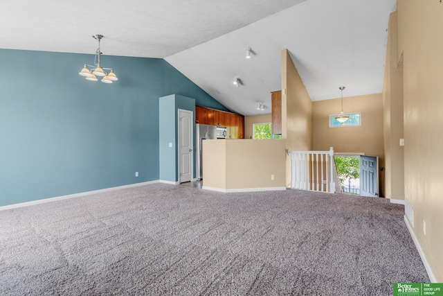 14463 Reynolds St, Omaha, NE 68007 - unfurnished living room with carpet floors, high vaulted ceiling, and a chandelier