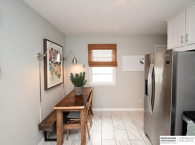 6144 Seward St, Omaha, NE 68104 - dining room with baseboards