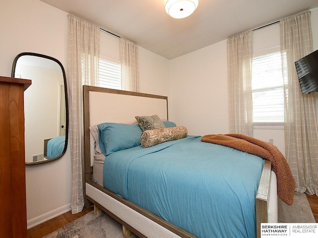 6144 Seward St, Omaha, NE 68104 - bedroom featuring wood finished floors and baseboards