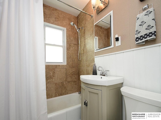 6144 Seward St, Omaha, NE 68104 - bathroom with shower / tub combo with curtain, vanity, toilet, and a decorative wall